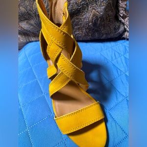 Yellow Lucky Brand zipper heels.